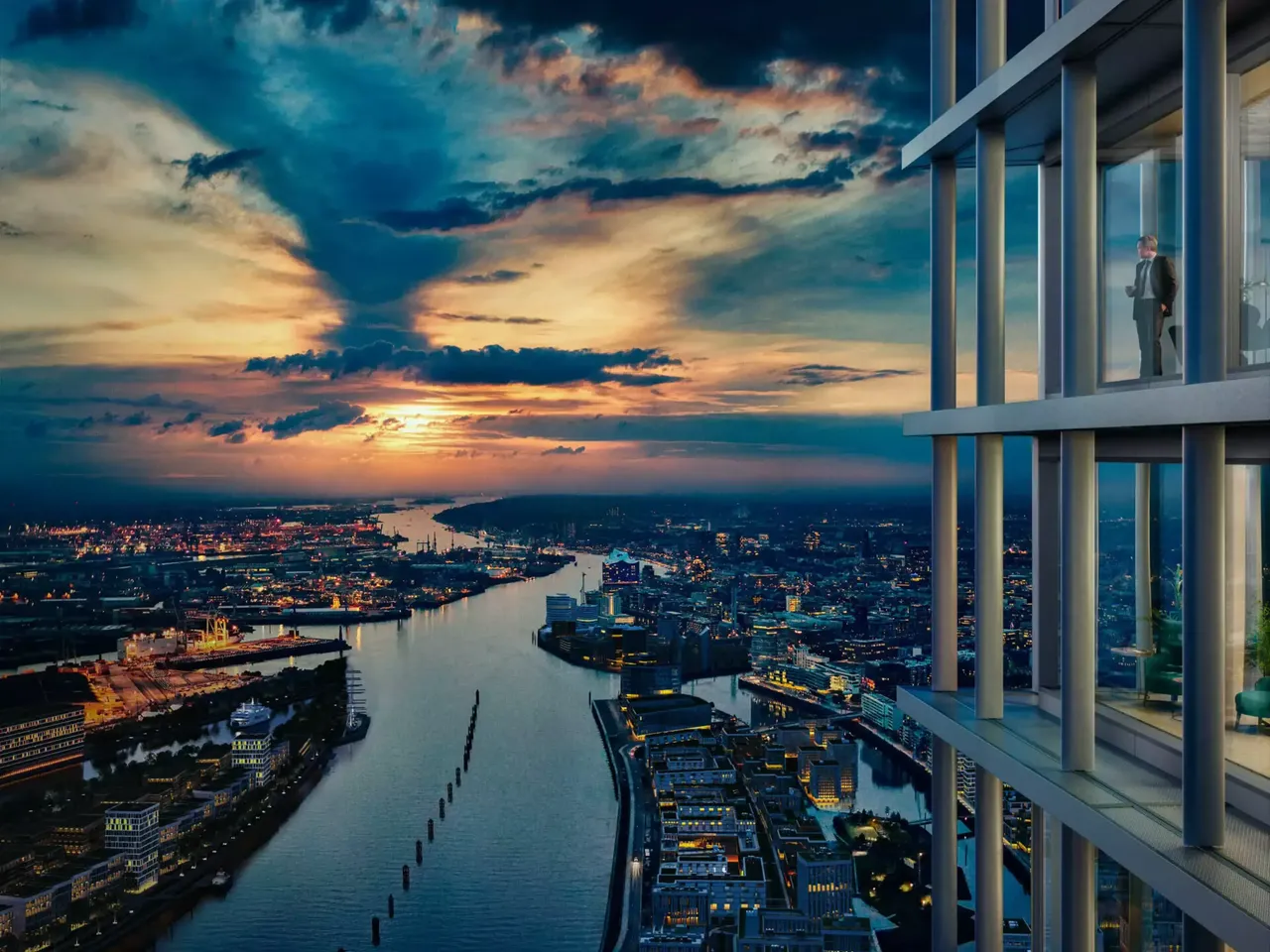 Ausblick: Es wird der Blick aus der hausInvest Immobilie Elbtower über die Hamburger Hafencity und die Elbphilharmonie im Sonnenuntergang abgebildet.
